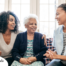A professional explains senior care options to a woman and her aging mom.