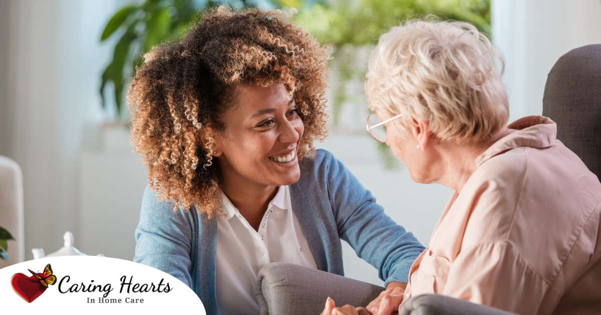 A woman enjoys compassionately providing caregiving services to an elderly woman.