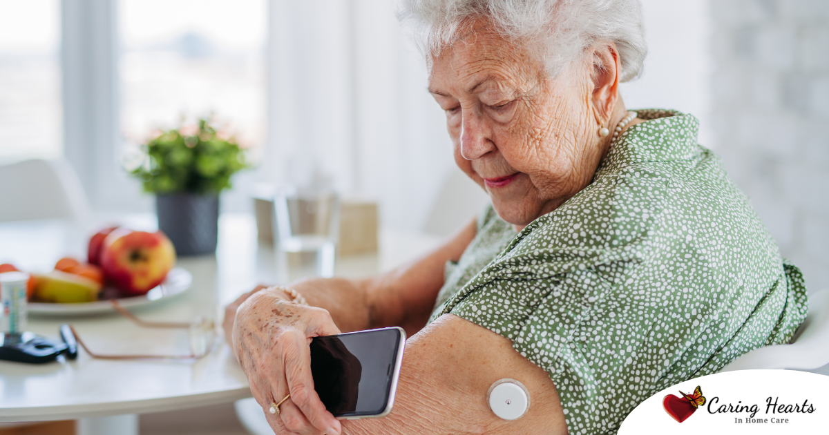 A senior woman uses her smartphone to check her glucose monitor, a tool that can be extremely helpful for diabetes care.