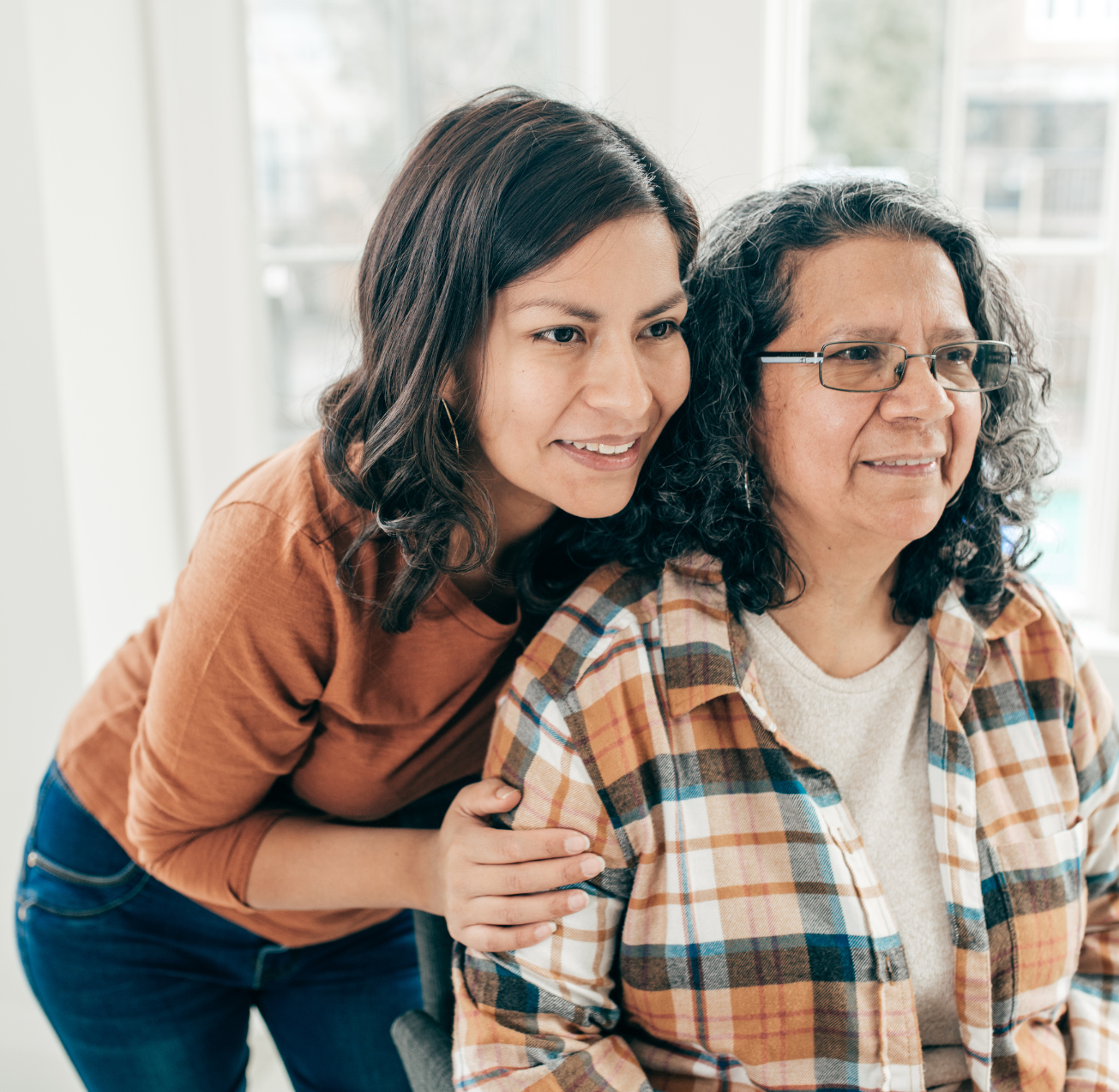 A caregiver hugs a senior client, representing premier private care in Prescott