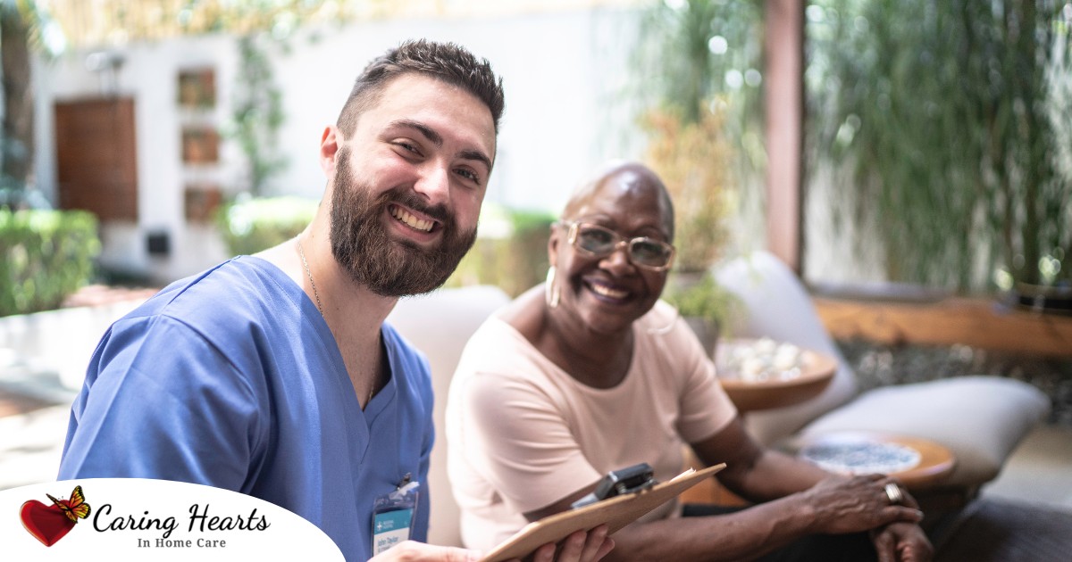 A man enjoys his caregiver job as he works with a client.