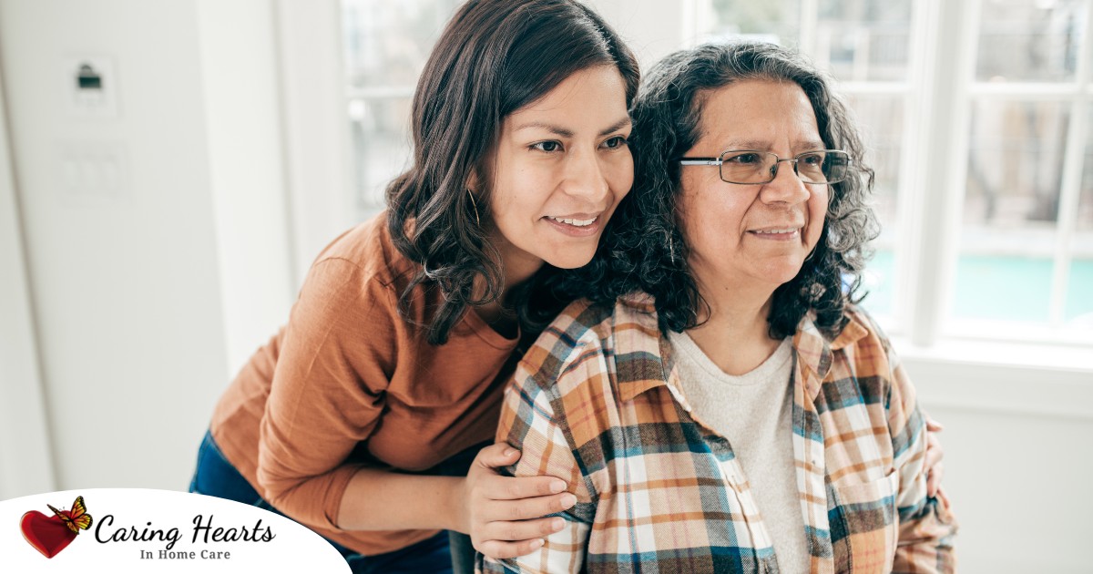 A woman hugs her older mother, representing compassionate senior care