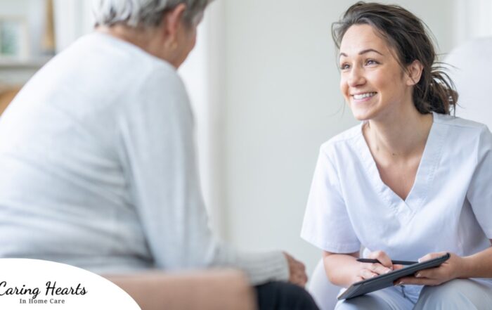 A woman smiles while with a client representing the pros of the home care industry.
